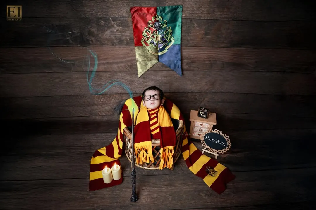 Our magical Harry Potter theme, complete with a Gryffindor scarf and wand. We specialize in bringing your imaginative ideas to life with detailed props and creative setups for a truly unique newborn photoshoot.