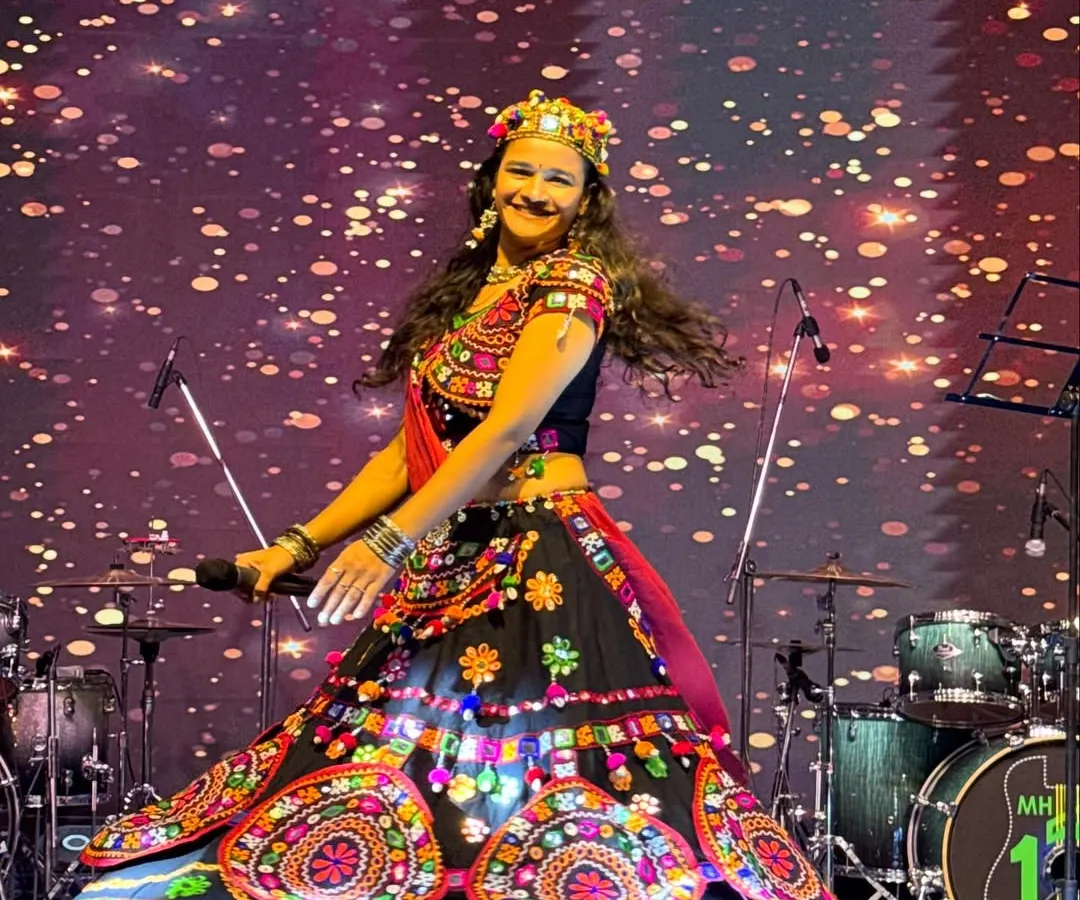 On stage, I come alive. This shot from a Navratri event captures the dynamic movement and vibrant energy I bring, modeling a stunning traditional ghagra choli.