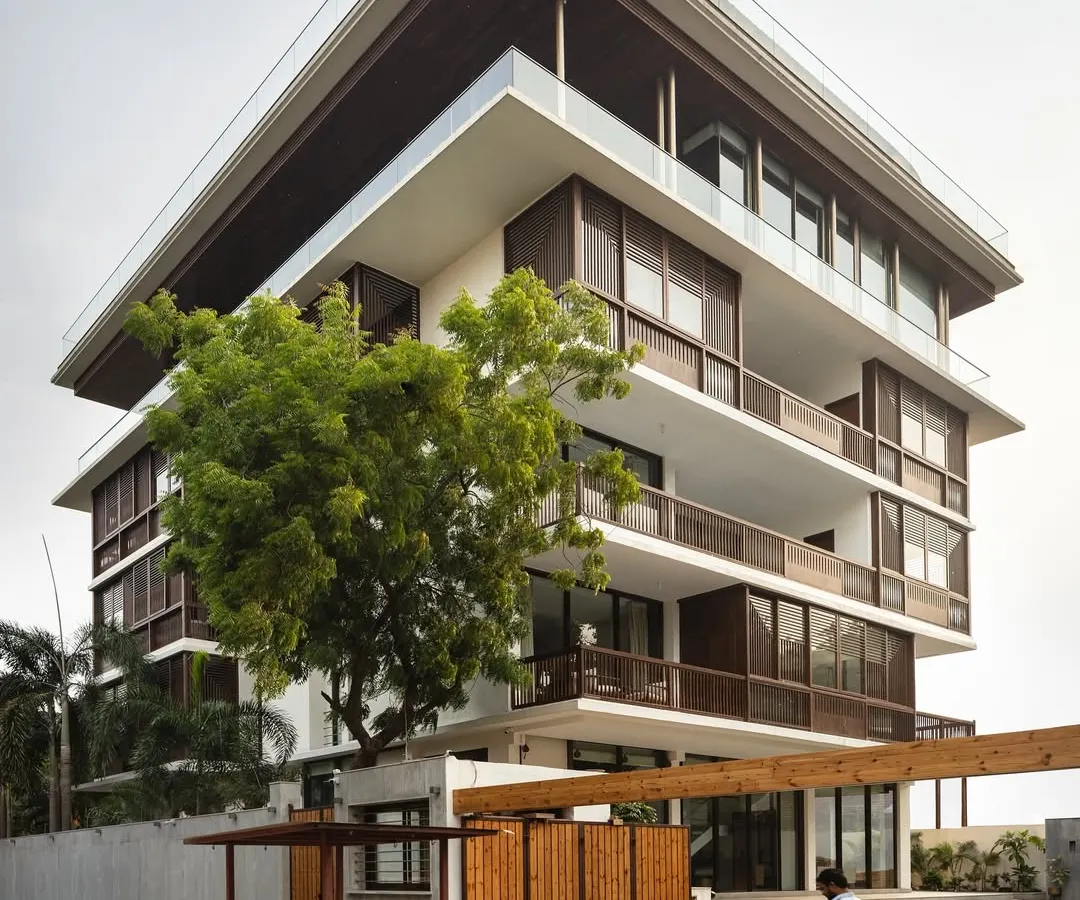 We believe a home should be in dialogue with its surroundings. This multi-generational residence in Nagpur, 'The Light House', uses operable timber screens and staggered balconies to create privacy and shade, while remaining connected to the life of the neighborhood.
