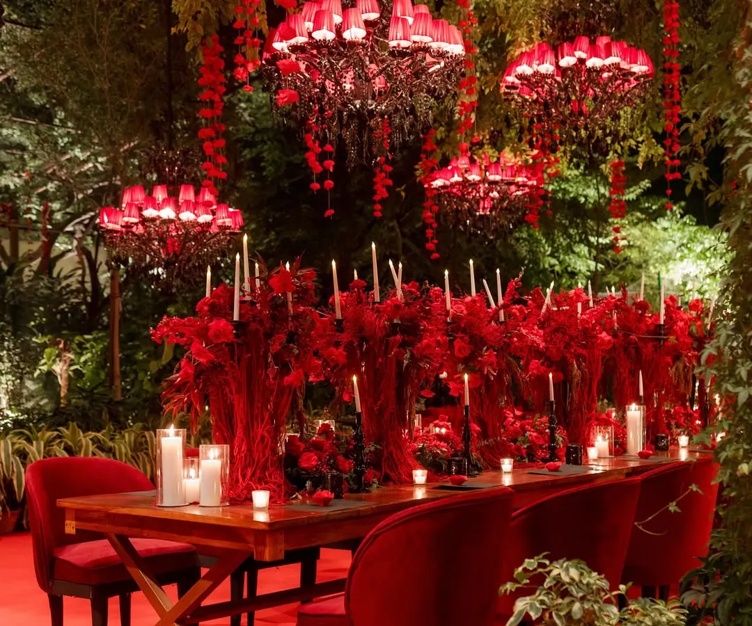 I believe in the power of a single, bold color to tell a story of passion and grandeur. In this 'Laal Bagh' concept, a garden was transformed into a dramatic, romantic dreamscape using rich red tones, custom chandeliers, and the warm glow of countless candles.
