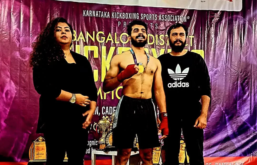 We don't just train, we build champions. Here is one of our athletes with his gold medal from the Bangalore District K1 Kickboxing Championship. This is the result of discipline and hard work.