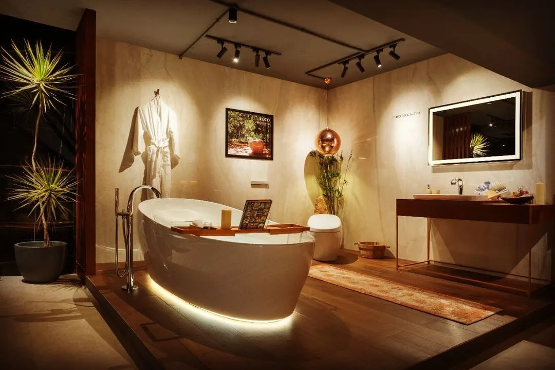 This bathroom design shows how lighting can create a personal spa. I used soft, indirect light under the bathtub for a floating effect, a backlit mirror for clear vanity lighting, and adjustable track lights to turn the artwork into a focal point.