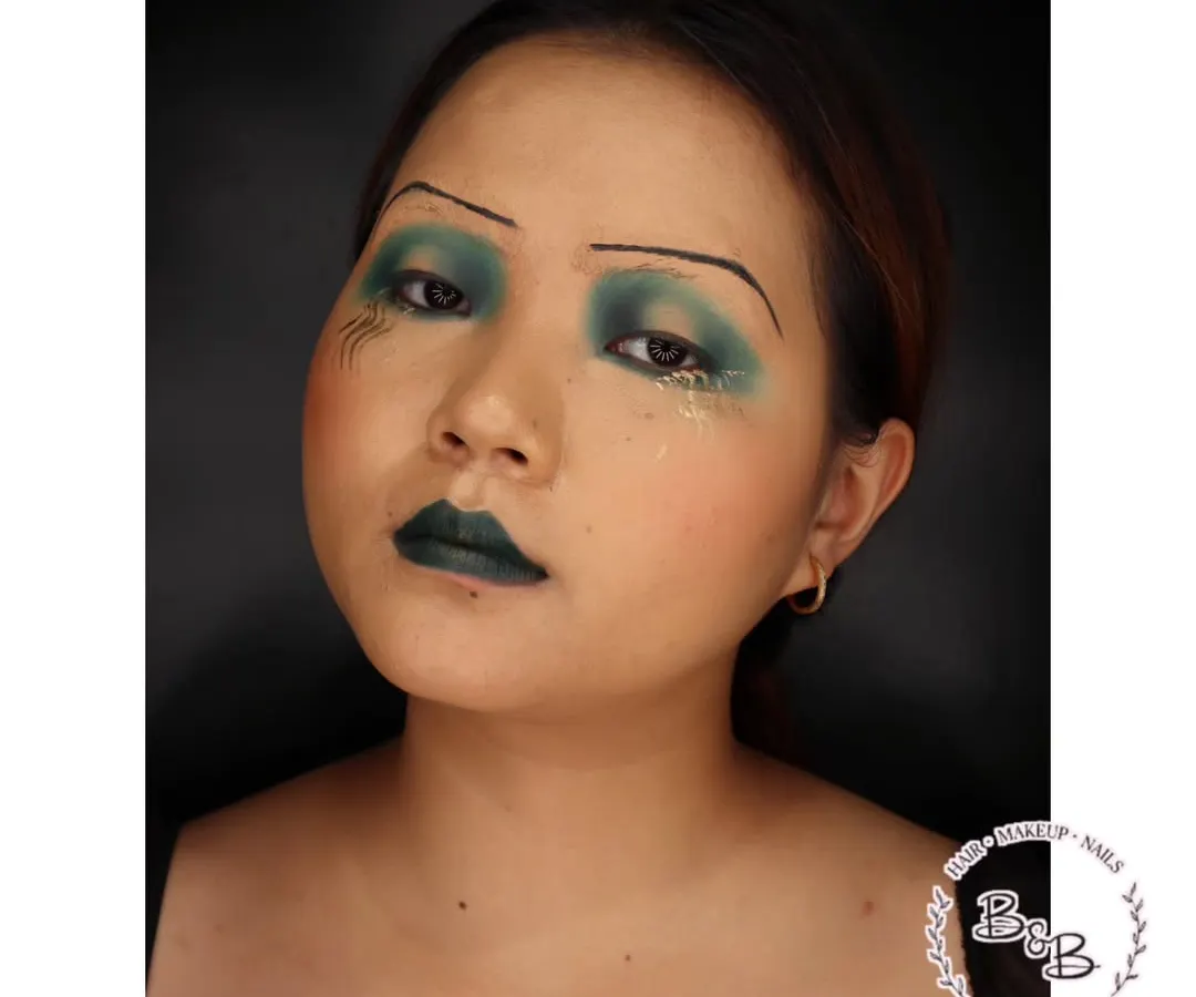 I love diving into the history of makeup, and this is my take on the 1920s "sad eye" look. I used droopy, dark eyeshadows, pencil-thin brows, and a defined cupid's bow lip to capture the dramatic and rebellious spirit of the era. This style is fantastic for period-themed photoshoots or character work.