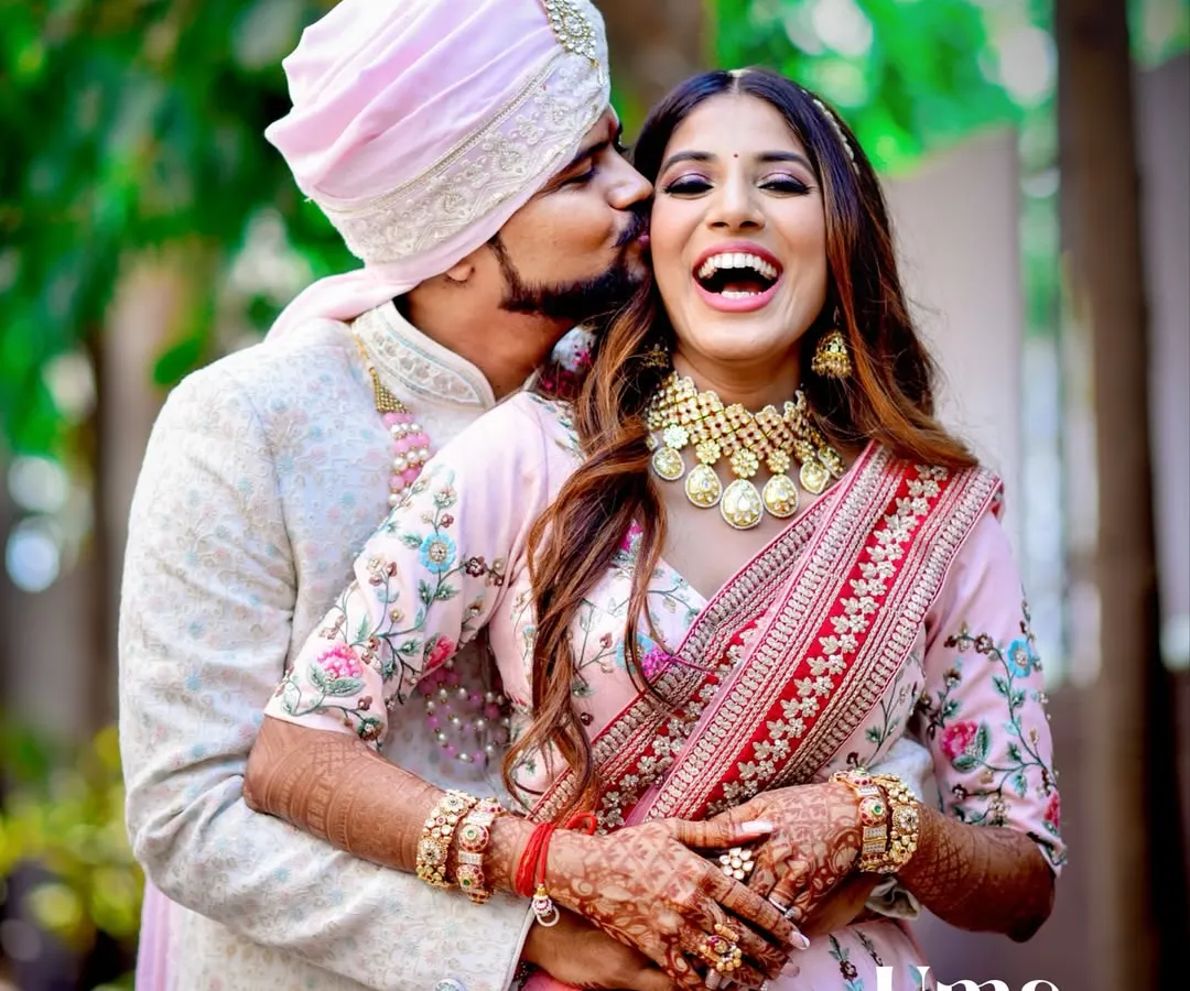 The pure, uninhibited laughter between a couple is what we live to capture. This candid shot showcases the genuine connection and happiness that make wedding photography so special.
