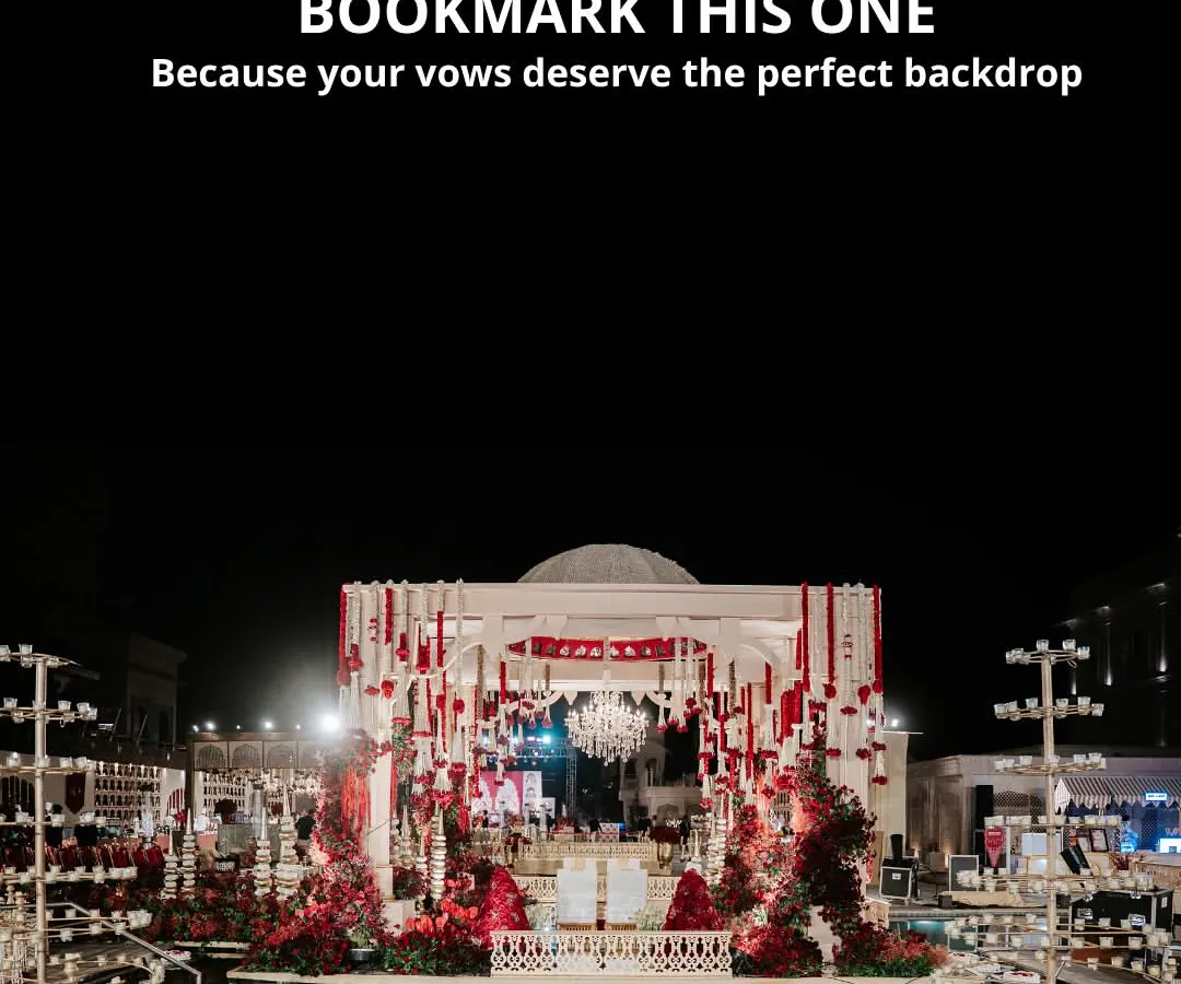 We transform magnificent venues into sacred spaces for your vows. This poolside mandap, set against the night sky with dramatic red florals and a cascading crystal chandelier, reflects our passion for creating opulent and deeply romantic wedding ceremony backdrops.