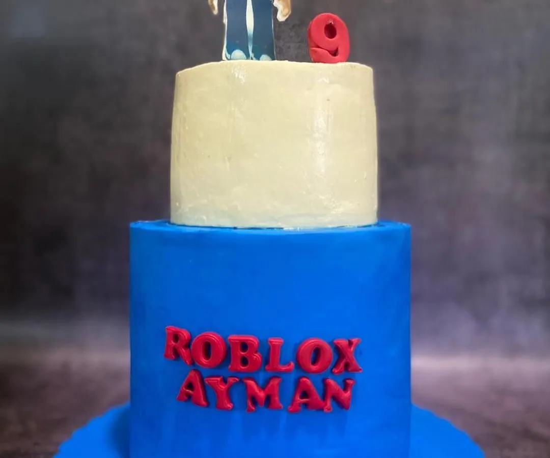 Bring on the fun themes! This two-tier Roblox cake was a blast to make for a 9th birthday. The bottom tier is a vibrant blue, with the birthday boy's name in the iconic Roblox font, and the top features a custom-made character topper.