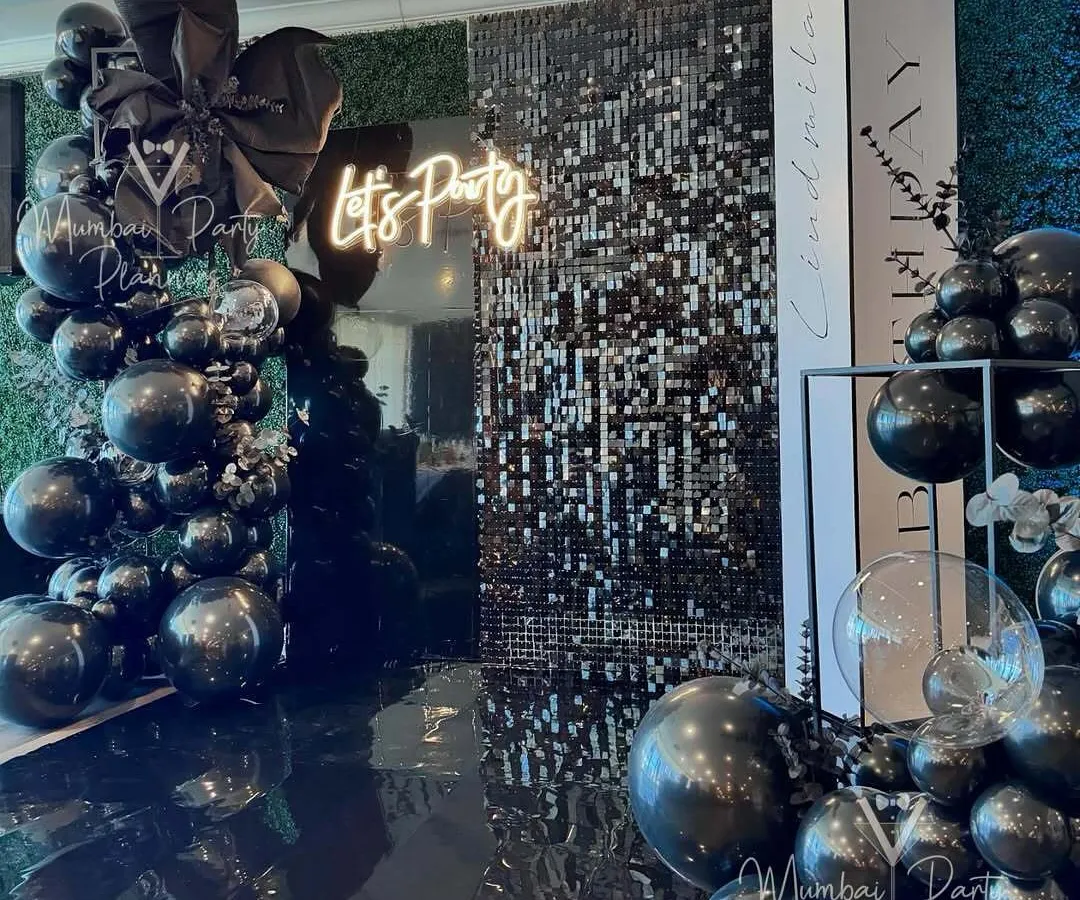 For a sophisticated and glamorous celebration, I designed this chic all-black party theme. The combination of a shimmering sequin wall, a custom neon sign, and dramatic balloon arrangements creates an unforgettable, high-end atmosphere for any adult birthday or event.