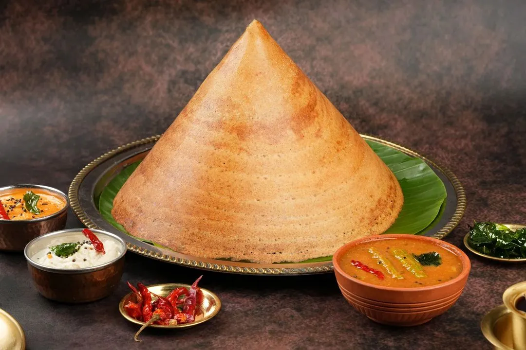 Capturing the impressive scale and perfect texture of this cone dosa was a fantastic challenge. We style traditional dishes to look authentic yet premium for high-end restaurant menus and delivery apps.