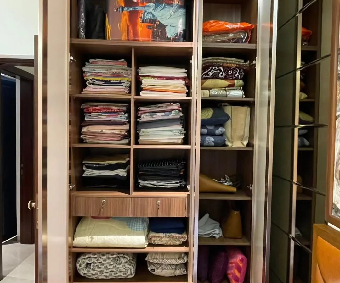 Opening the doors reveals the true intelligence of the design: a fully customized interior with smart storage solutions. We've included a variety of shelves and compartments for folded clothes, bags, and accessories, making organization effortless.