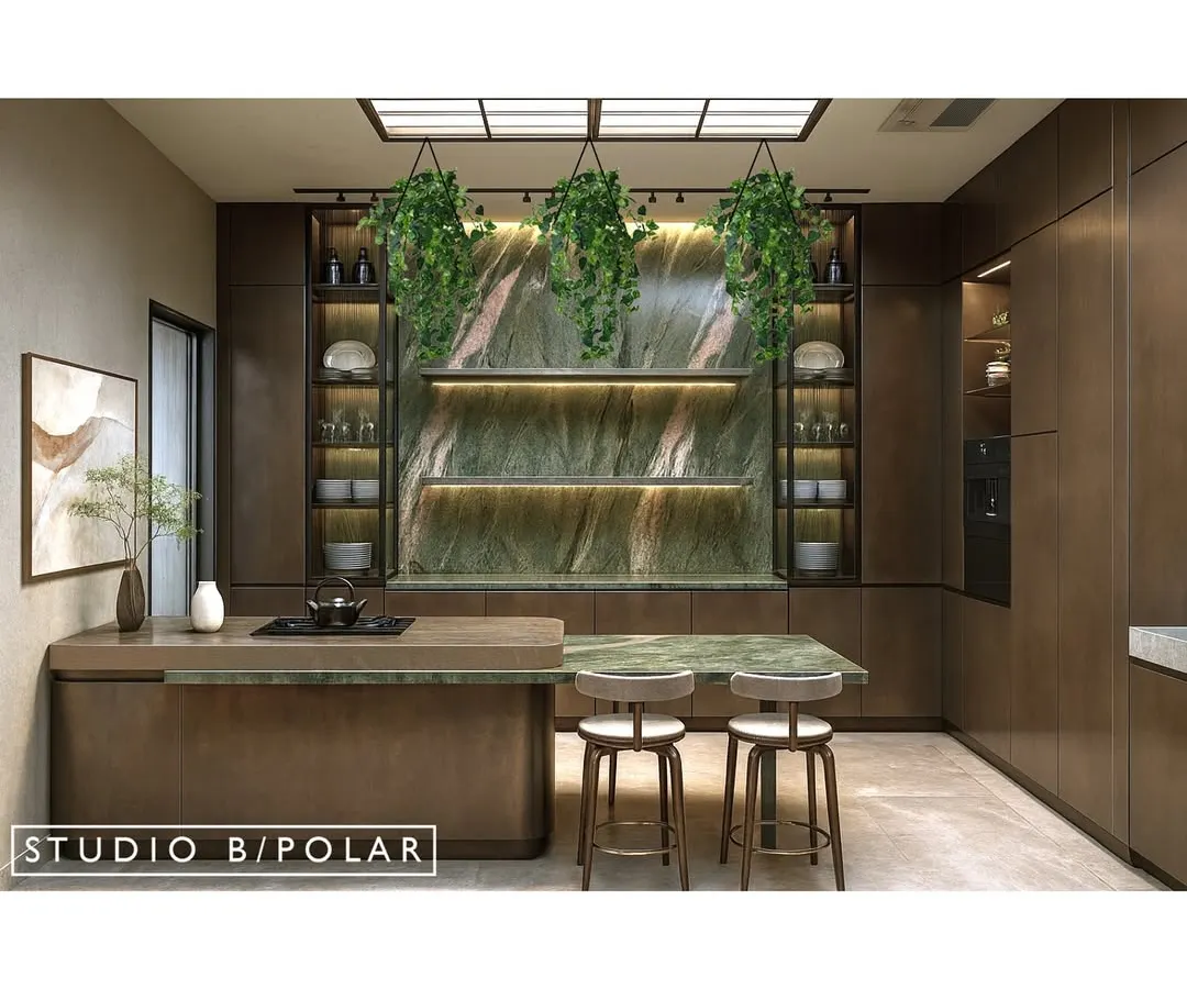 We believe kitchens should be as beautiful as they are functional. In this design, a stunning green stone serves as the backsplash and artistic centerpiece, complemented by the soft glow from a stretch ceiling and the contemporary touch of brushed metal finishes on the cabinetry.