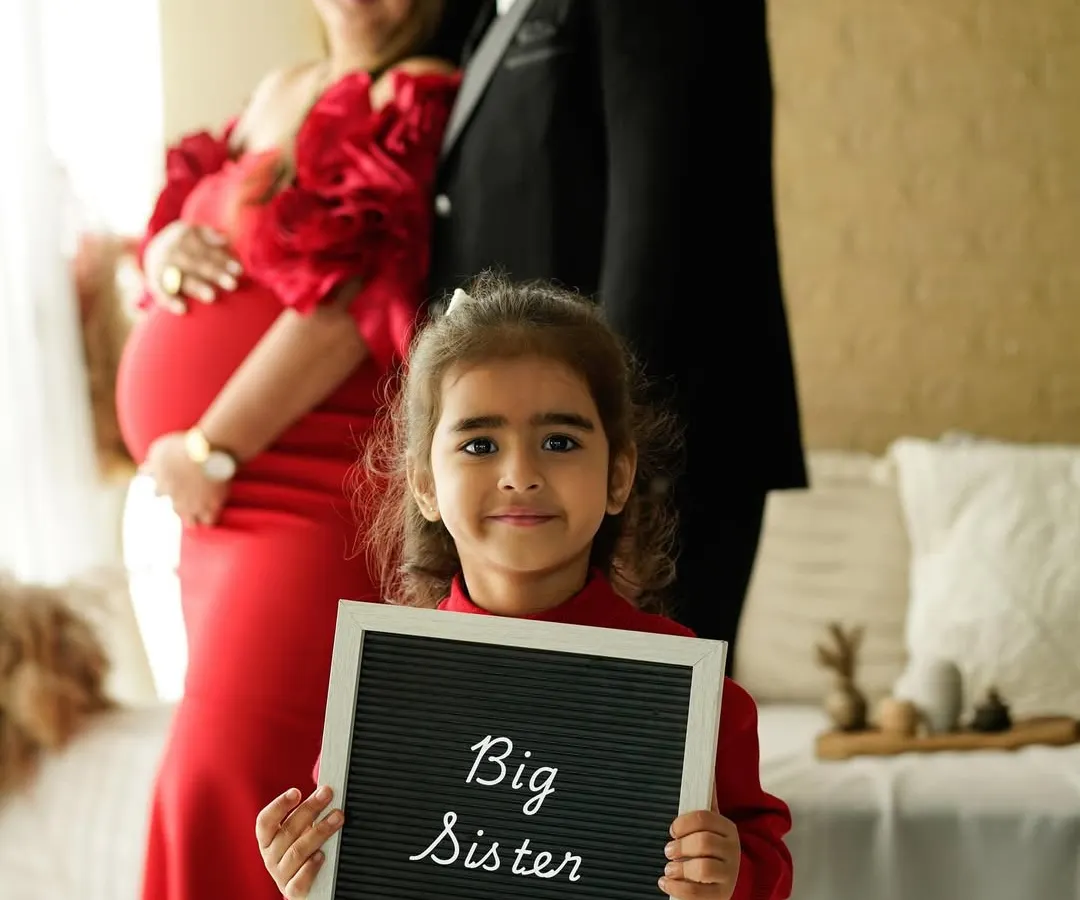 Welcoming a new baby is a joy for the whole family. We love capturing the excitement of siblings, like in this sweet "Big Sister" announcement.