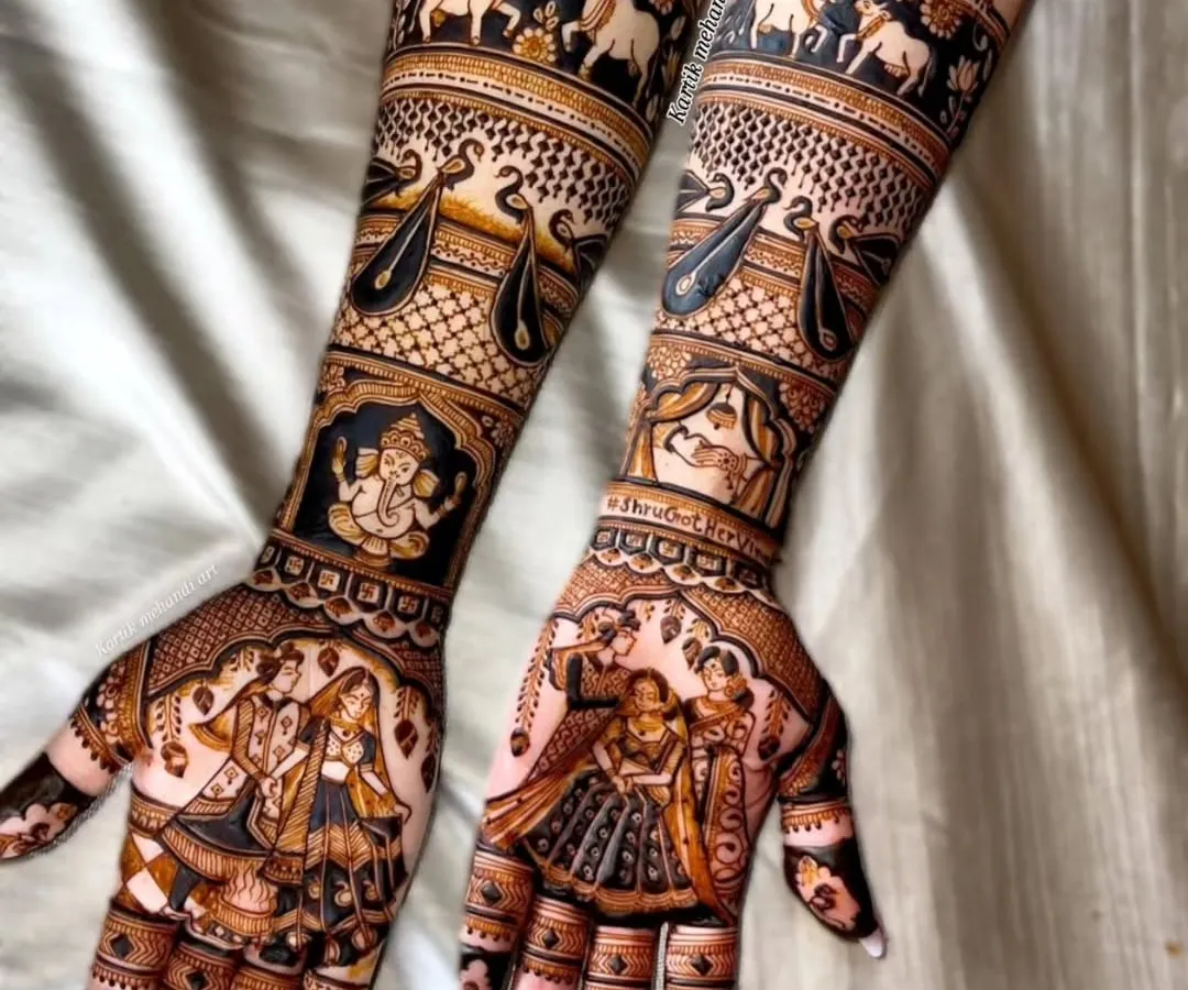 A perfect example of our full-coverage traditional bridal mehandi. This design features incredibly detailed figures, including a varmala scene, Lord Ganesha for blessings, and bands of elephants and swans, all executed with fine lines and perfect symmetry.