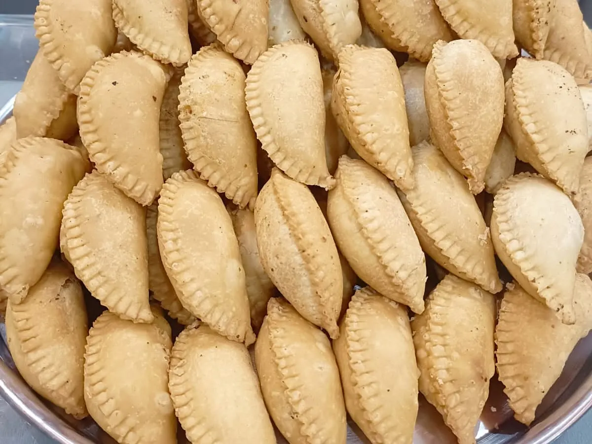 Rows of our Dry Fruits Mawa Gujhiya fill a tray, ready as a homemade sweet for festivals and poojas.