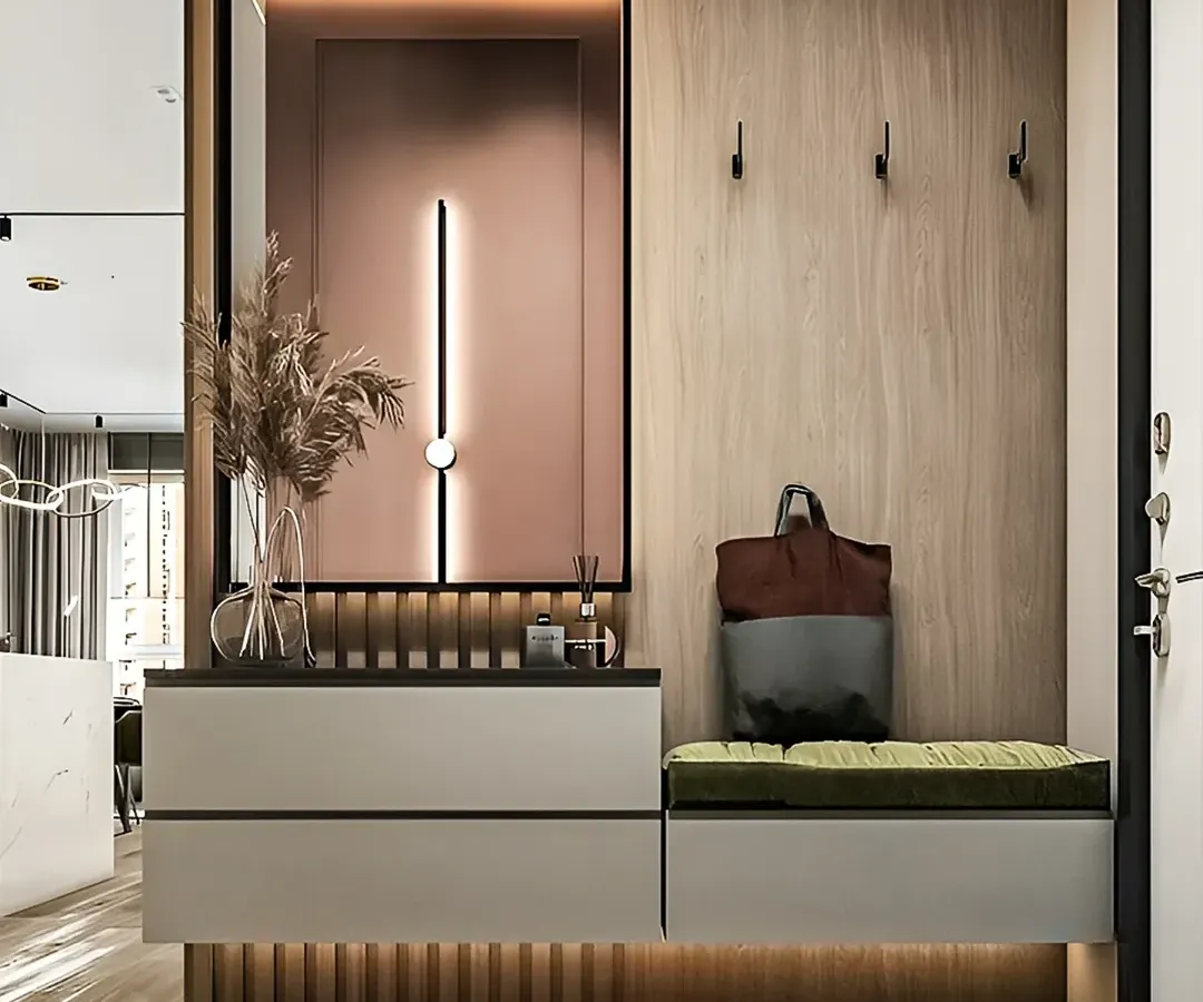 This entryway design concept combines style and practicality. We included a comfortable cushioned bench for seating, sleek hooks for coats and bags, and integrated drawers for shoe storage, all set against a backdrop of elegant wood and fluted panels.