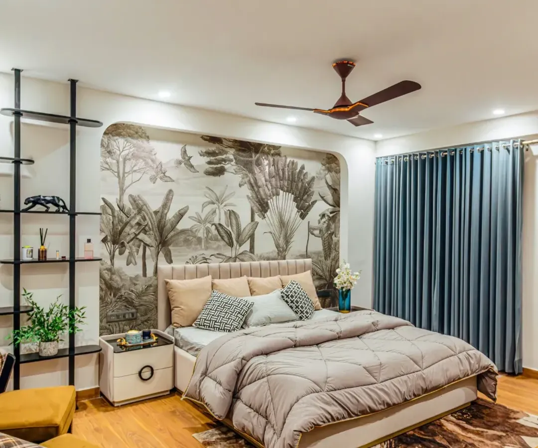 I believe a bedroom should be a personal sanctuary. Here, a custom botanical mural acts as a stunning feature wall, bringing nature indoors and creating a serene, calming environment. The design balances this artistic touch with plush textures and warm wood flooring for ultimate comfort.