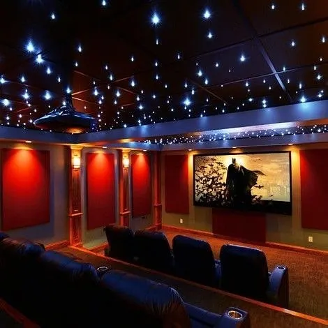 A modern home theater featuring our signature starlight ceiling, creating a magical ambiance for movie nights. The design incorporates clean lines, integrated wall lighting, and premium acoustic panels to ensure both stunning visuals and flawless sound.