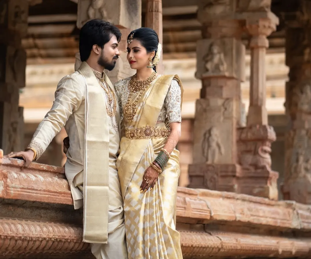 Set against the timeless grandeur of a heritage temple, this portrait is about capturing love that feels as enduring as the stone carvings around them. It's a blend of cultural elegance and a deeply personal connection.