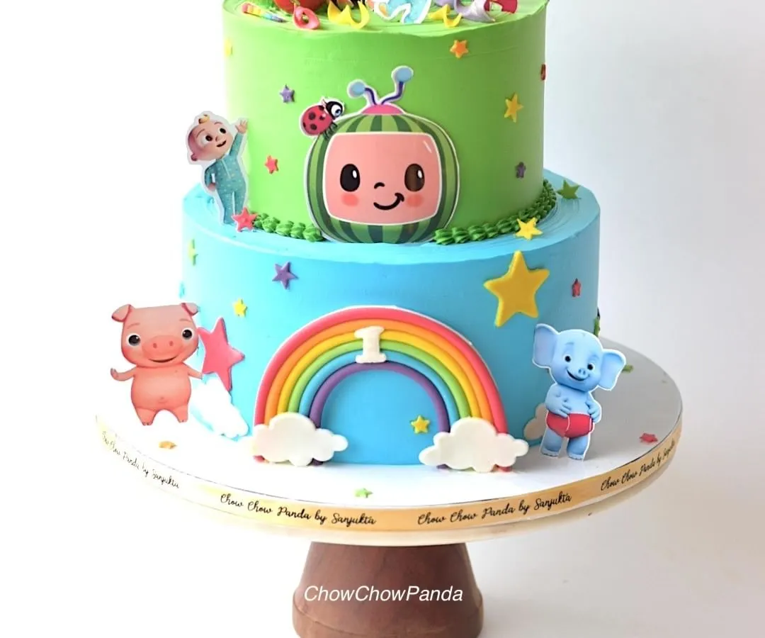 For the little ones who love Cocomelon, I designed this cheerful two-tier cake. The bottom tier features a rainbow and characters, while the top tier brings the whole Cocomelon family together, all made with smooth, delicious buttercream.