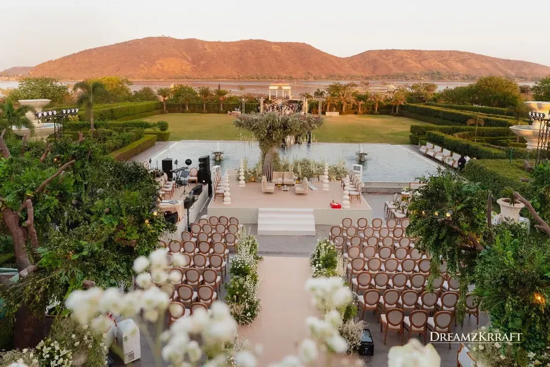 An elegant morning ceremony set against the serene lawns of Udaipur. The clean white and green palette, with a sculptural floral tree as the centerpiece, shows my dedication to creating sophisticated and architecturally inspired designs.