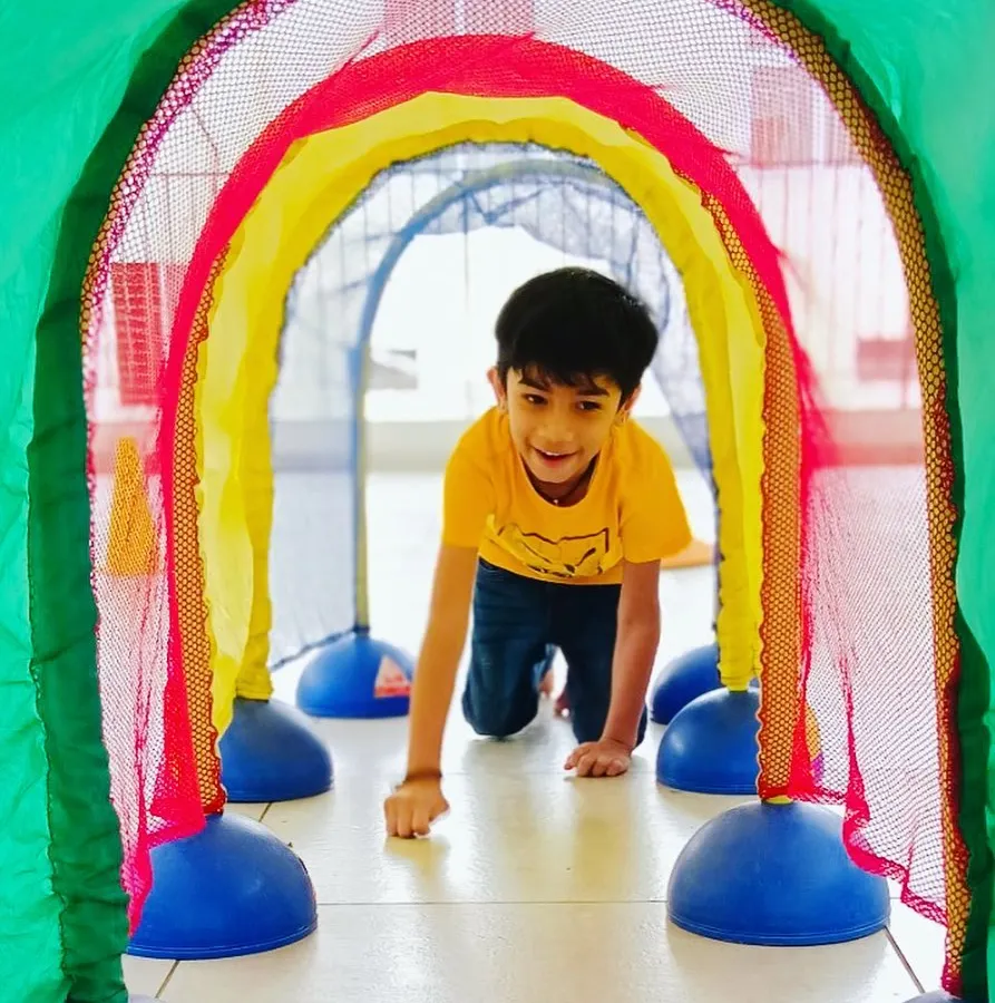 This colorful crawling tunnel is part of an obstacle course designed to improve agility and confidence. It's amazing to see a child's face light up with accomplishment after navigating a new challenge.
