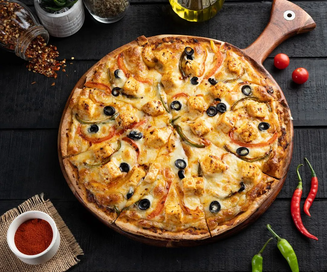 For this pizza, I created a dark, moody atmosphere to make the vibrant toppings and melted cheese the undeniable hero. The overhead angle, known as a flat lay, allows customers to see all the fresh ingredients at once, making it a perfect shot for menus and social media promotions.