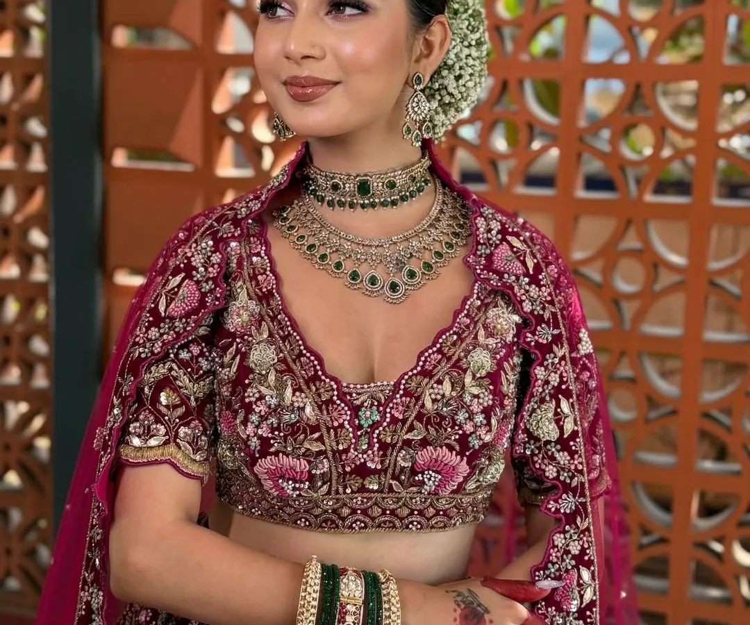 A classic bridal look is all about timeless elegance. Here, I created a soft, dewy makeup look with a focus on enhancing her natural features. The subtle smokey eye, paired with a neutral lip and a traditional gajra bun, completes this stunning bridal transformation, perfect for the main wedding ceremony.
