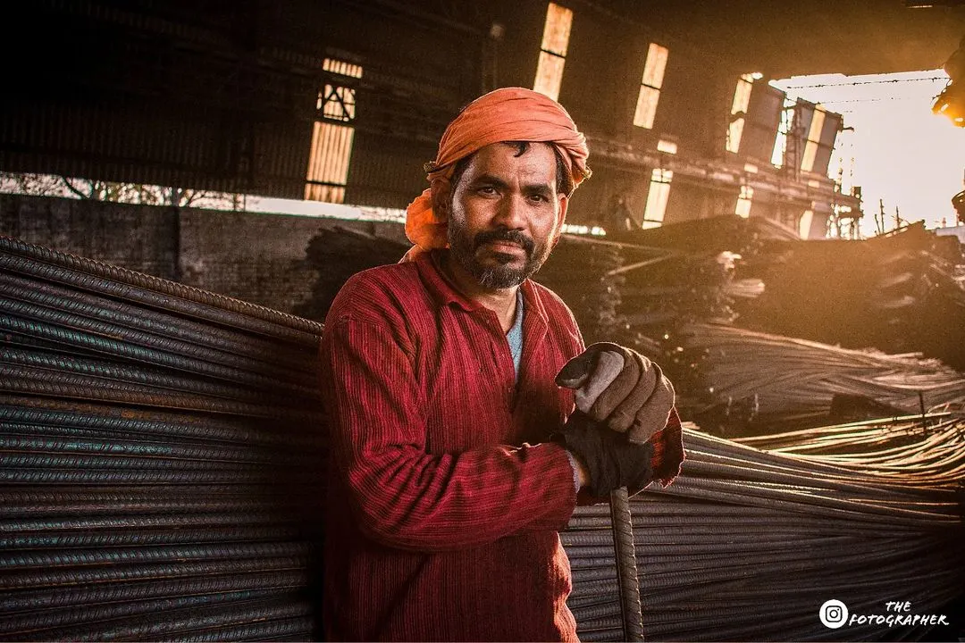 For me, photography is about finding beauty everywhere. This portrait of a worker, captured in the golden light of a factory, shows the power of authentic, environmental portraiture.