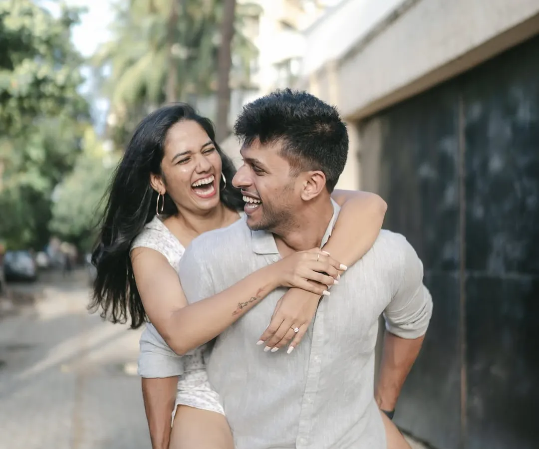 A pre-wedding shoot should be filled with your genuine energy. We captured this spontaneous, joyful piggyback ride to reflect the couple's playful and carefree connection.