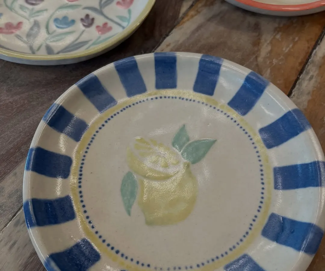 Just look at these beautiful plates painted by people in our workshops. It's amazing to see everyone's unique style come to life with color and glaze.