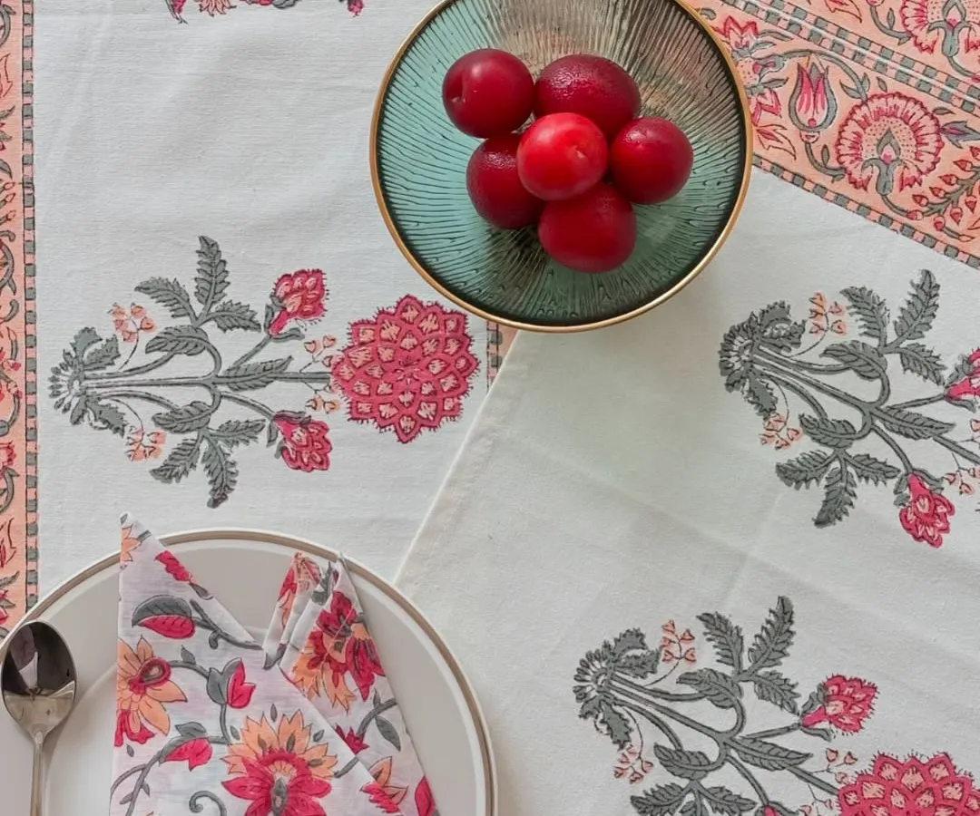 I believe every meal can be a special occasion. This complete table linen set, featuring a runner, placemats, and napkins in a soft peach floral design, adds a touch of handcrafted elegance to your dining table.