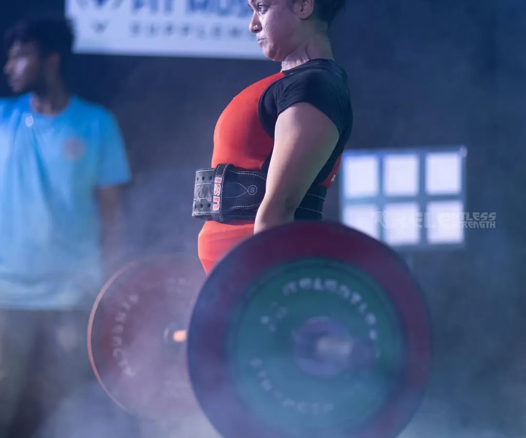 This is the kind of strength I help you build. A moment of pure focus and power during a deadlift at my first powerlifting competition. My coaching will guide you to master foundational lifts like this, focusing on proper form to build strength safely and effectively, whether you're a beginner or a seasoned lifter.