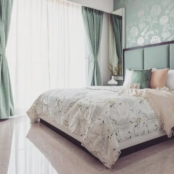 A bedroom should be a sanctuary. We helped select this calming sage green palette, pairing a solid colour with a delicate floral accent wall to create a peaceful and elegant atmosphere.