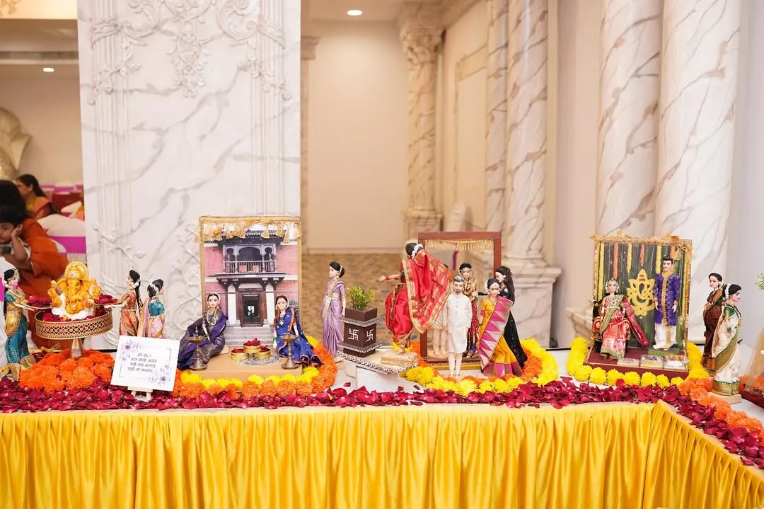 A wide view of one of our complete 'Dohale Jevan' or baby shower rukhwat displays. We arrange multiple themed scenes, from a traditional 'wada' setting to a depiction of the mother-to-be, creating a beautiful and meaningful centerpiece for the celebration.