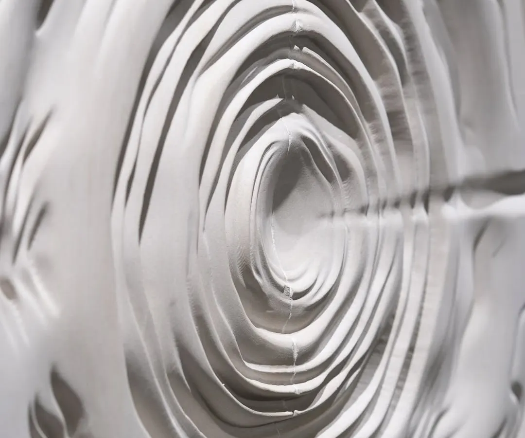 For me, a surface should have a soul. This is a close-up of a sculptural wall panel I designed, where every concentric layer is carved to create a sense of movement and depth. It’s not just a wall; it’s a centerpiece that transforms the energy of a room.