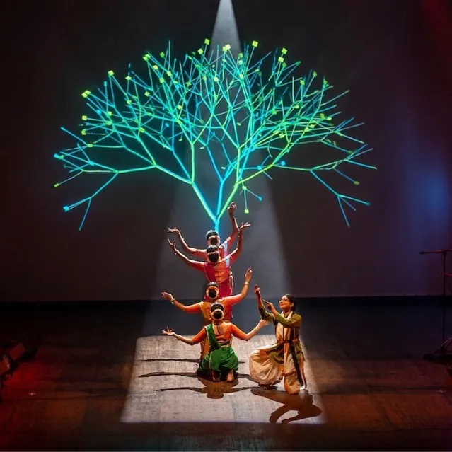 From my production 'Antariksha Sanchar', this scene uses digital art to create a celestial tree of life. My choreography often integrates such visual elements to build immersive worlds on stage, blending ancient stories with futuristic aesthetics.