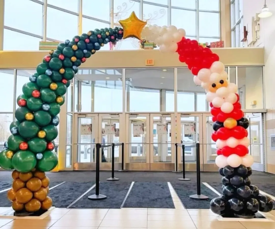 Talk about a grand entrance! We had so much fun creating this unique Christmas balloon arch, shaped like a Christmas tree flowing into Santa Claus. This large scale balloon sculpture is a super fun way to welcome guests and employees. 🎉