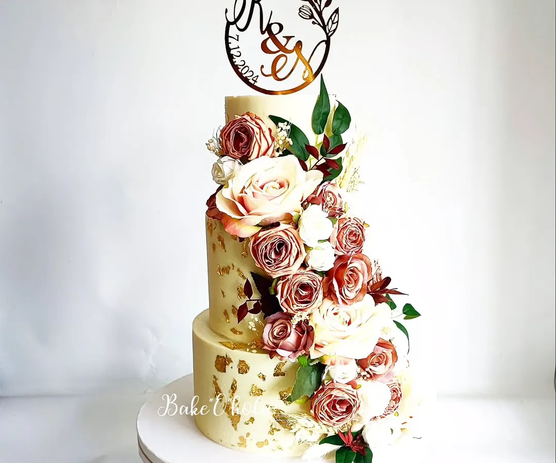 For moments that call for sheer elegance, this three-tier wedding cake is a perfect choice. This 6kg Belgian chocolate truffle cake features a cascade of dusty rose and cream flowers, creating a timeless centerpiece for a couple's special day.