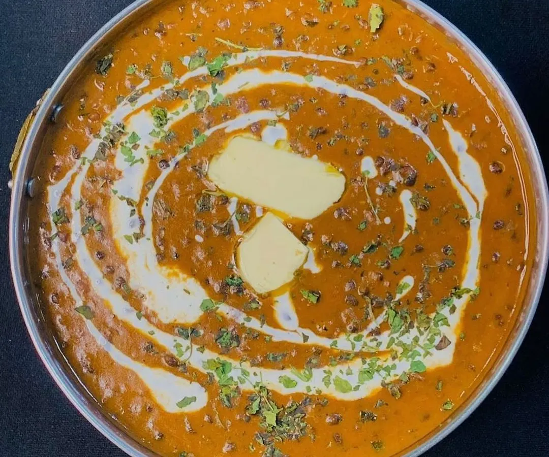 My Dal Makhni is a true crowd-pleaser, slow-cooked to perfection for a rich and creamy texture. It's topped with a dollop of butter and fresh cream, making it a must-have for any North Indian vegetarian catering menu in Gurgaon.