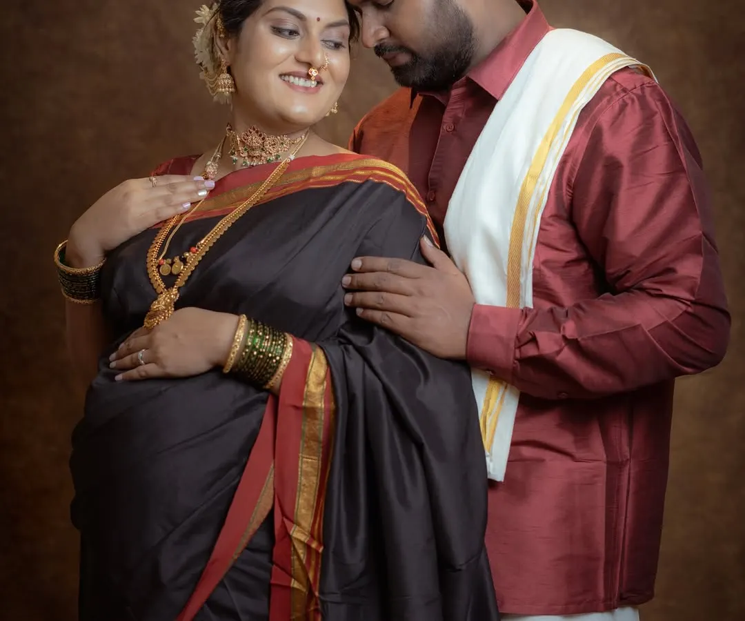 An intimate moment between an expecting couple during a fine-art studio session. I guide my clients into poses that feel natural and loving, capturing the connection and excitement you share.