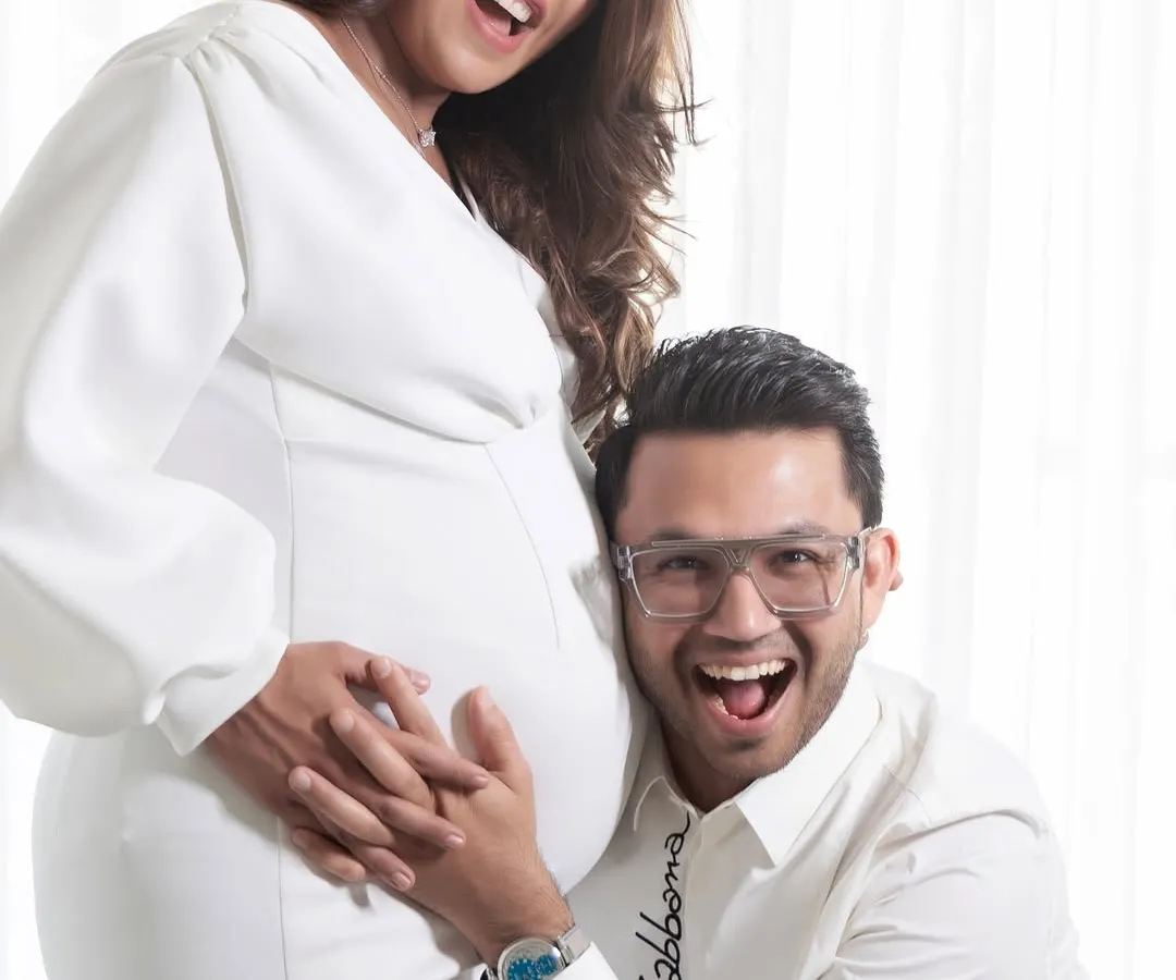 The pure joy of expecting. This all-white studio session captures the fun and excitement between a couple as they await their new arrival. My goal is to make you feel comfortable, so your real personalities shine through.