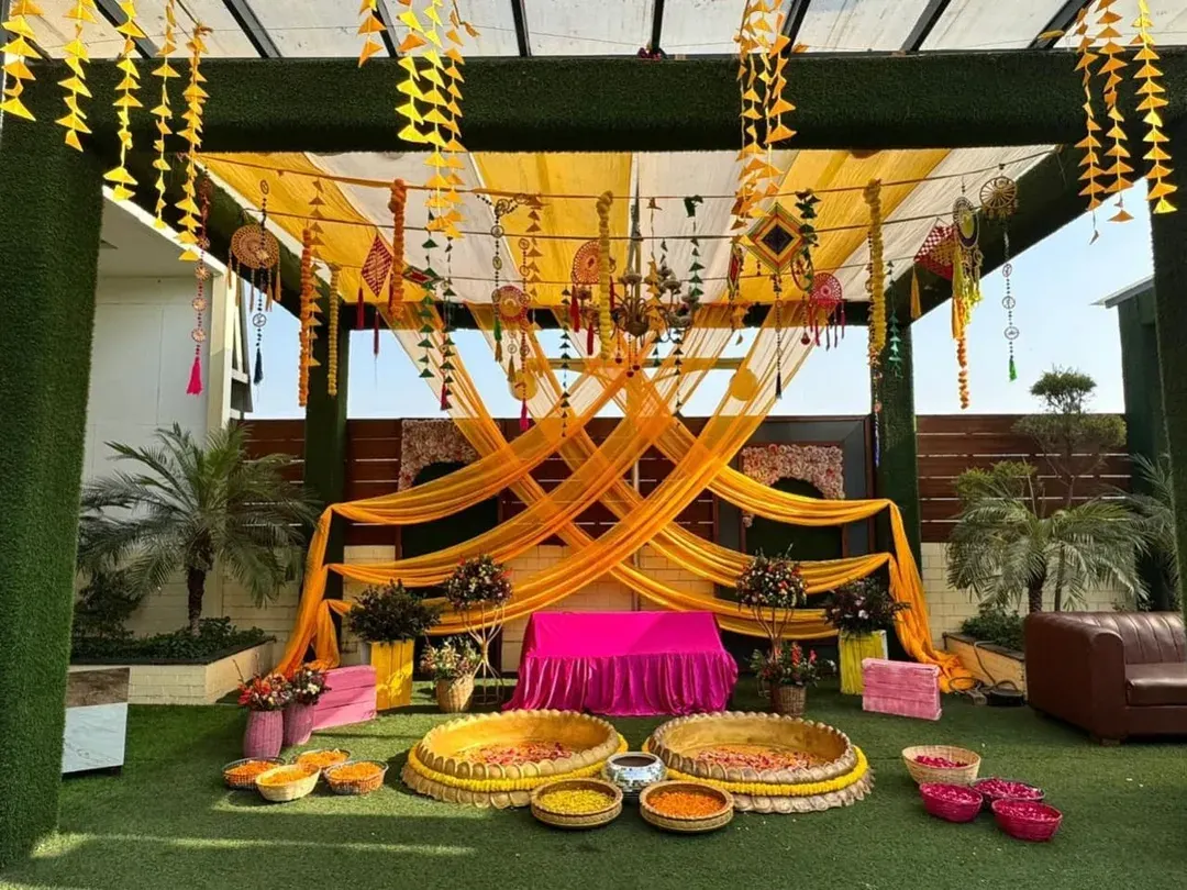 I love bringing vibrant energy to Haldi ceremonies. This outdoor setup uses traditional marigolds and yellow drapes, creating a picture-perfect backdrop for a day full of fun, laughter, and unforgettable moments.
