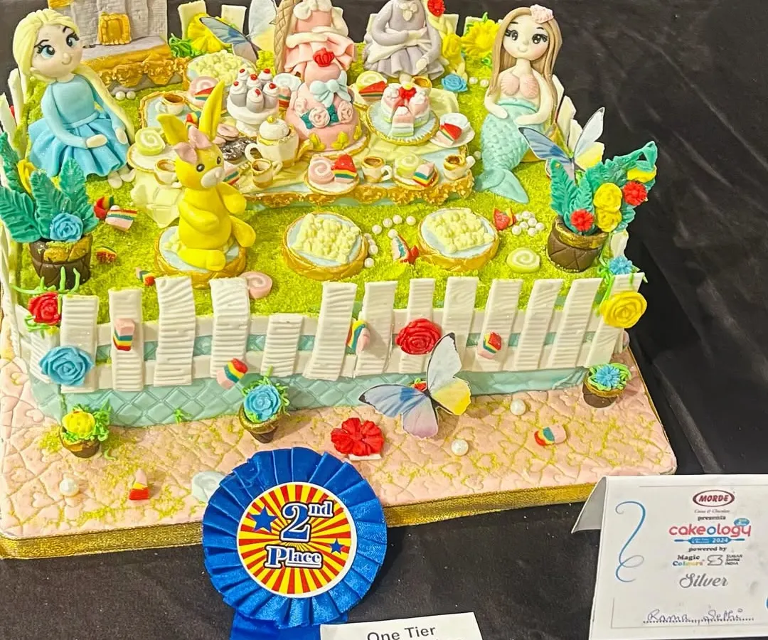 I poured my heart into this piece for the national Cakeology competition and was so proud to bring home the silver award. It’s a whimsical tea party with some of my favorite characters, and every tiny detail is sculpted from sugar.