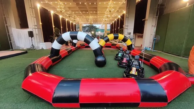 We provide a full Go-Karting experience with an inflatable track and multiple electric karts. This setup is perfect for larger spaces and provides safe, high-speed fun for kids and teens.