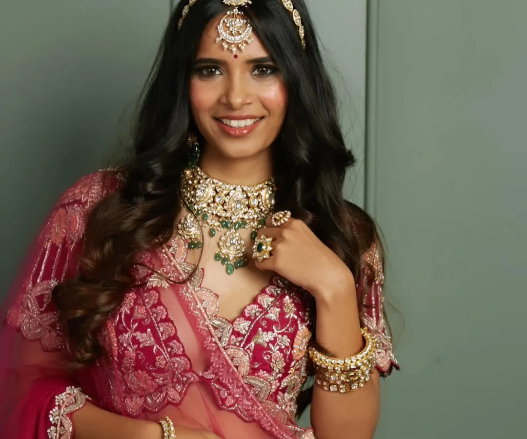 This is the bridal radiance I love to create. A gorgeous traditional bride with classic smokey eyes, a perfect pink lip, and soft, open waves, ready for her big day.