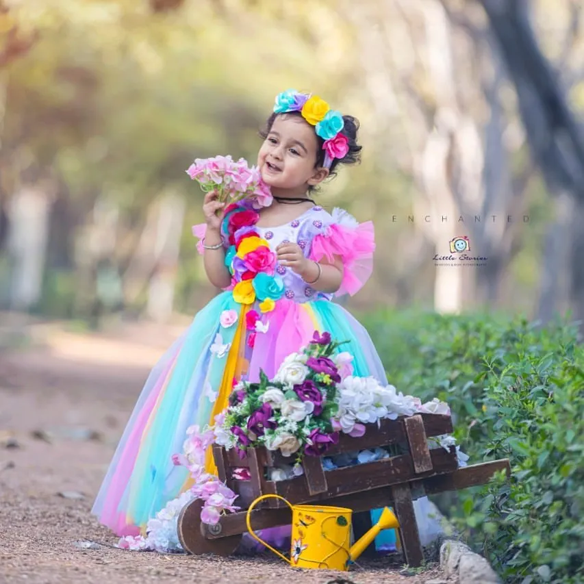I believe every child deserves to feel like they are in a fairytale. For this enchanted outdoor portrait, I used a custom gown and floral props to create a whimsical scene that lets a child's imagination bloom.