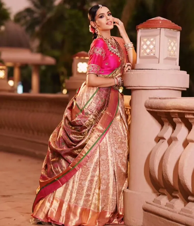 I love transforming a traditional Kanjeevaram silk saree into a contemporary lehenga style. This look is perfect for a sangeet or reception, and I can show you how to create this stunning silhouette that combines comfort with regal elegance.