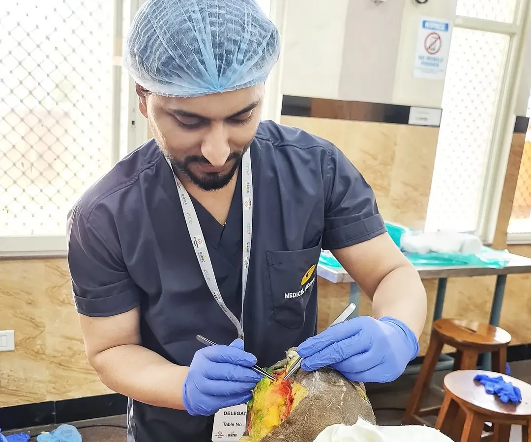 Here I am focused during a hands-on dermatosurgery workshop. My training in surgical dermatology allows me to perform precise procedures for conditions like moles, cysts, and keloids, always prioritizing patient safety and effective results.