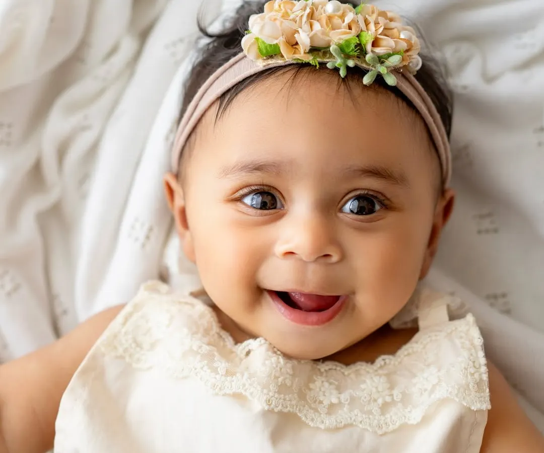 Oh, that smile! This is from a 6-month milestone session, and it's pure magic. I focus on capturing these simple, authentic expressions up close because they are the ones you'll want to remember forever.