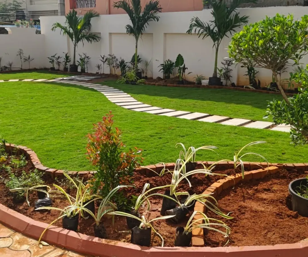 A look at a classic residential garden we recently completed. We installed a clean, curved stepping stone path through a vibrant green lawn and created raised, brick-edged garden beds to make planting and maintenance simple for the homeowner.