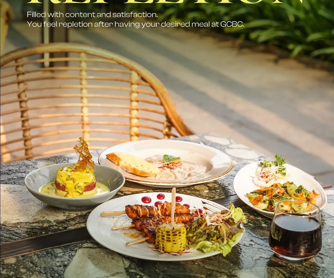 I believe food should be a feast for the eyes and the soul. Here's a look at a typical table at my place, loaded with a variety of dishes from our global menu, like grilled skewers, creamy pasta, and fresh salads. It’s all about sharing good food and feeling completely satisfied.